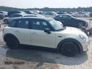 2020 MINI Hardtop 4 Door Cooper with VIN WMWXU7C01L2M54710, listed as a IAAI auction lot 42385956 with 55,714 mi miles and . Bid and sale history available at DreamBid. Image 13.