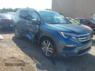 2017 Honda Pilot Touring with VIN 5FNYF5H96HB032210, listed as a IAAI auction lot 42450213 with 109,262 mi miles and . Bid and sale history available at DreamBid. Image 1.