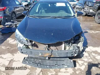 2017 Toyota Corolla L z VIN 5YFBURHE0HP721258, wystawiony jako IAAI lot #41706824 z przebiegiem 158 554 mil mil oraz . Historia ofert i sprzedaży dostępna na DreamBid. Obrazek 13.