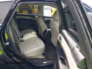 2014 Cadillac SRX Performance Collection with VIN 3GYFNCE31ES683465, listed as a IAAI auction lot 42107705 with 117,285 mi miles. Bid and sale history available at carsss.com. Image 8.