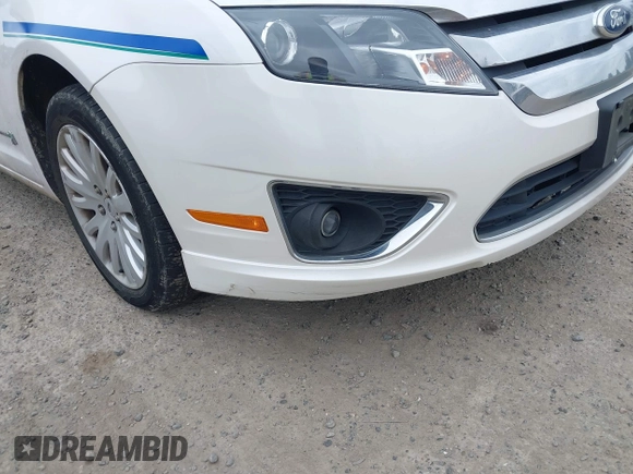 2011 Ford Fusion Hybrid z VIN 3FADP0L34BR202769, wystawiony jako IAAI lot #42504494 z przebiegiem 33 902 mil mil oraz . Historia ofert i sprzedaży dostępna na DreamBid. Obrazek 6.