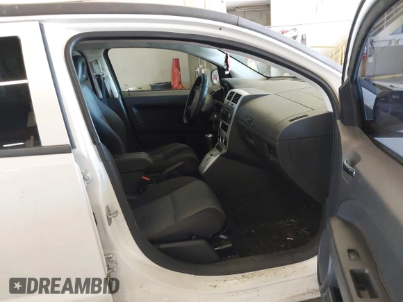 2009 Dodge Caliber SXT with VIN 1B3HB48A89D116734, listed as a IAAI auction lot 41959281 with 209,136 mi miles and . Bid and sale history available at DreamBid. Image 5.