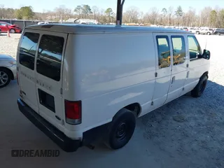 1999 Ford Econoline Cargo with VIN 1FTRE1429XHC29847, listed as a IAAI auction lot 41680406 with 262,002 mi miles. Bid and sale history available at carsss.com. Image 4.