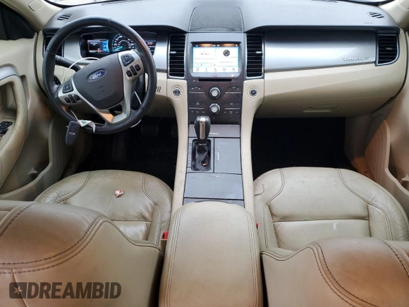 2016 Ford Taurus SEL with VIN 1FAHP2E9XGG144955, listed as a Copart auction lot 82207634 with 128,823 mi miles and Salvage Title. Bid and sale history available at DreamBid. Image 8.