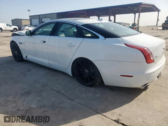 2014 Jaguar XJ Supercharged z VIN SAJWA1GT4EMV60053, wystawiony jako Copart lot #57643005 z przebiegiem 48 139 mil mil oraz Szkoda całkowita • Salvage title. Historia ofert i sprzedaży dostępna na DreamBid. Obrazek 2.