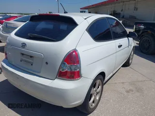 2007 Hyundai Accent SE with VIN KMHCN36C47U009459, listed as a IAAI auction lot 41979395 with 202,844 mi miles. Bid and sale history available at carsss.com. Image 4.