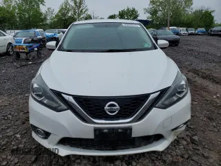 2018 Nissan Sentra S with VIN 3N1AB7AP8JY256044, listed as a Copart auction lot 55600075 with 58,963 mi miles and Salvage Title. Bid and sale history available at DreamBid. Image 5.