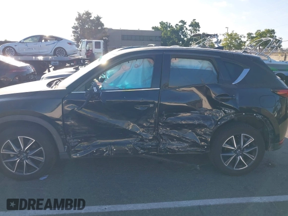 2018 Mazda CX-5 Grand Touring with VIN JM3KFBDM1J0345014, listed as a IAAI auction lot 42703926 with 151,453 mi miles and . Bid and sale history available at DreamBid. Image 6.