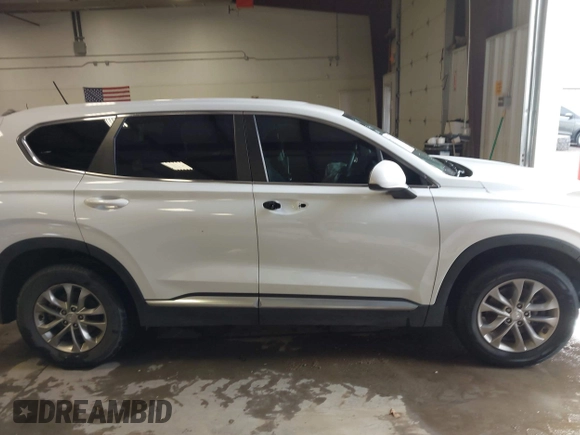 2019 Hyundai Santa Fe SE with VIN 5NMS23AD1KH063472, listed as a IAAI auction lot 41375650 with 64,496 mi miles and . Bid and sale history available at DreamBid. Image 14.