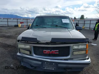 1999 GMC Yukon with VIN 1GKEK13R2XJ712390, listed as a IAAI auction lot 41793649 with 222,721 mi miles. Bid and sale history available at carsss.com. Image 13.
