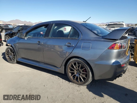 2015 Mitsubishi Lancer Evolution Final Edition z VIN JA32W7FV0FU027962, wystawiony jako Copart lot #85763774 z przebiegiem 56 671 mil mil oraz Szkoda całkowita • Salvage title. Historia ofert i sprzedaży dostępna na DreamBid. Obrazek 2.