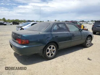 1996 Toyota Camry LE with VIN 4T1BF12K5TU861825, listed as a Copart auction lot 59803174 with 217,650 mi miles and Salvage title. Bid and sale history available at DreamBid. Image 3.