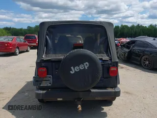 2002 Jeep Wrangler X z VIN 1J4FA39S82P735794, wystawiony jako IAAI lot #42411386 z przebiegiem 141 219 mil mil oraz . Historia ofert i sprzedaży dostępna na DreamBid. Obrazek 15.