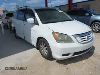 2009 Honda Odyssey EX-L with VIN 5FNRL386X9B056552, listed as a IAAI auction lot 42126144 with 194,722 mi miles. Bid and sale history available at carsss.com. Image 1.