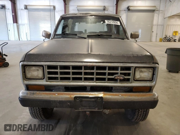 1988 Ford Bronco with VIN 1FMCU14T4JUA54161, listed as a Copart auction lot 76312054 with 34,932 mi miles and Salvage title. Bid and sale history available at DreamBid. Image 5.