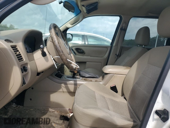 2006 Ford Escape XLT with VIN 1FMYU03146KC34615, listed as a Copart auction lot 55096195 with 144,398 mi miles and Salvage Title. Bid and sale history available at DreamBid. Image 7.
