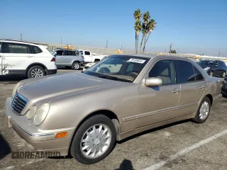 2000 Mercedes-Benz E-Class AWD with VIN WDBJF82G0YX029026, listed as a Copart auction lot 78106604 with 134,482 mi miles and Salvage Title. Bid and sale history available at carsss.com. Image 1.