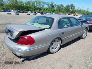 2001 Lincoln Continental z VIN 1LNHM97V31Y638576, wystawiony jako IAAI lot #42305531 z przebiegiem Nie podano mil oraz . Historia ofert i sprzedaży dostępna na DreamBid. Obrazek 4.