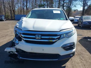 2017 Honda Pilot Touring z VIN 5FNYF6H99HB089121, wystawiony jako IAAI lot #41896878 z przebiegiem 145 330 mil mil oraz . Historia ofert i sprzedaży dostępna na DreamBid. Obrazek 12.