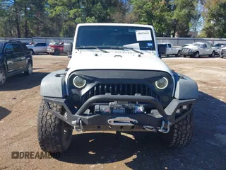 2017 Jeep Wrangler Unlimited Sport with VIN 1C4BJWDG4HL502861, listed as a IAAI auction lot 40895010 with 62,970 mi miles. Bid and sale history available at carsss.com. Image 12.