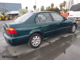 1999 Honda Civic VP with VIN 2HGEJ6618XH579736, listed as a IAAI auction lot 41912296 with 268,631 mi miles. Bid and sale history available at carsss.com. Image 4.