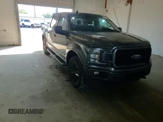 2020 Ford F-150 XL with VIN 1FTEW1E44LFC02735, listed as a Copart auction lot 62062125 with 111,471 mi miles and Salvage title. Bid and sale history available at DreamBid. Image 13.