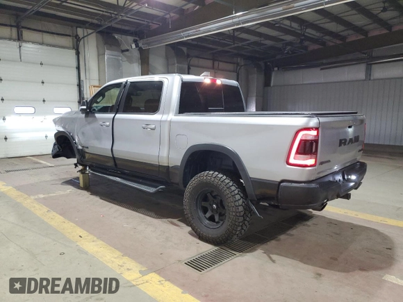 2022 Ram 1500 Rebel z VIN 1C6SRFLT1NN258780, wystawiony jako Copart lot #53040405 z przebiegiem 27 307 mil mil oraz Szkoda całkowita • Salvage title. Historia ofert i sprzedaży dostępna na DreamBid. Obrazek 2.