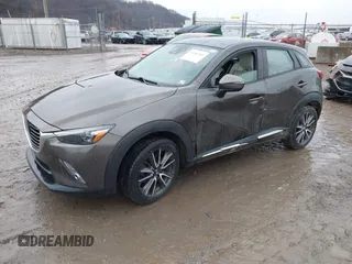 2016 Mazda CX-3 Grand Touring with VIN JM1DKBD77G0107328, listed as a IAAI auction lot 41682949 with 156,935 mi miles. Bid and sale history available at carsss.com. Image 17.