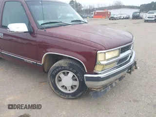 1999 Chevrolet Suburban with VIN 3GNEC16R5XG114890, listed as a IAAI auction lot 41345029 with 274,687 mi miles. Bid and sale history available at carsss.com. Image 12.