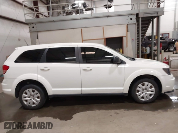 2015 Dodge Journey American Value z VIN 3C4PDCAB4FT714200, wystawiony jako IAAI lot #42199910 z przebiegiem 205 009 mil mil oraz . Historia ofert i sprzedaży dostępna na DreamBid. Obrazek 13.