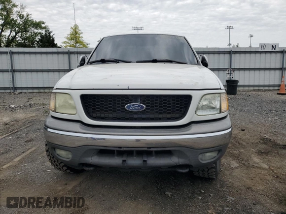 2003 Ford F-150 XL z VIN 2FTRX18L93CA55860, wystawiony jako Copart lot #57402295 z przebiegiem 312 879 mil mil oraz Szkoda całkowita • Salvage title. Historia ofert i sprzedaży dostępna na DreamBid. Obrazek 5.