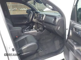 2023 Toyota Tacoma SR5 z VIN 3TMDZ5BN2PM144461, wystawiony jako IAAI lot #41565934 z przebiegiem 75 547 mil mil oraz . Historia ofert i sprzedaży dostępna na DreamBid. Obrazek 5.