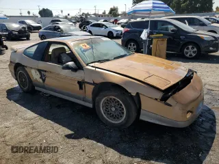 1987 Pontiac Fiero GT z VIN 1G2PG1194HP216891, wystawiony jako Copart lot #72103234 z przebiegiem 55 013 mil mil oraz Tytuł czysty. Historia ofert i sprzedaży dostępna na DreamBid. Obrazek 4.