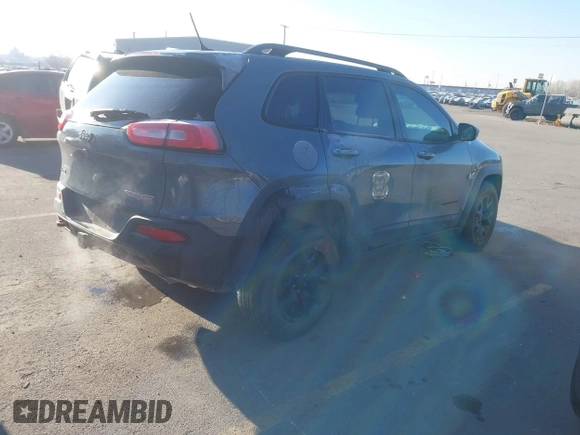 2015 Jeep Cherokee Trailhawk with VIN 1C4PJMBS3FW510219, listed as a IAAI auction lot 41440297 with 144,012 mi miles and . Bid and sale history available at DreamBid. Image 4.