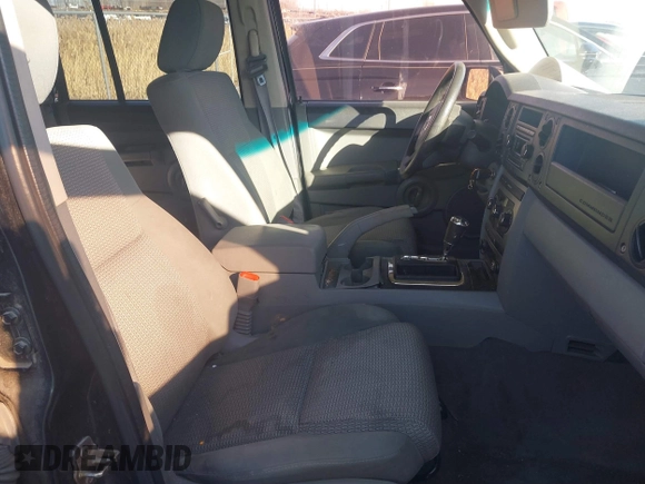 2007 Jeep Commander Sport z VIN 1J8HG48K37C647814, wystawiony jako IAAI lot #41428248 z przebiegiem 224 137 mil mil oraz . Historia ofert i sprzedaży dostępna na DreamBid. Obrazek 5.