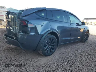 2023 Tesla Model X with VIN 7SAXCAE5XPF384061, listed as a Copart auction lot 86834084 with 6,974 mi miles and Salvage Title. Bid and sale history available at DreamBid. Image 3.
