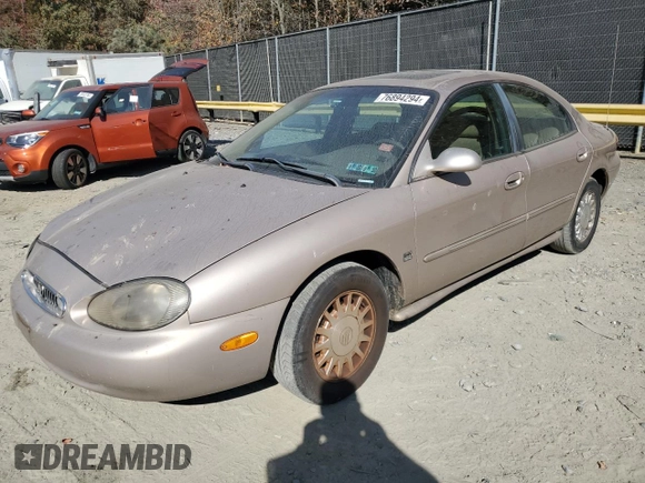 1999 Mercury Sable LS z VIN 1MEFM53S7XG602788, wystawiony jako Copart lot #76894294 z przebiegiem 186 315 mil mil oraz Szkoda całkowita • Salvage title. Historia ofert i sprzedaży dostępna na DreamBid. Obrazek 1.