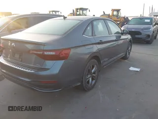 2023 Volkswagen Jetta SE with VIN 3VW7M7BUXPM012396, listed as a IAAI auction lot 42073638 with 24,593 mi miles and . Bid and sale history available at DreamBid. Image 4.