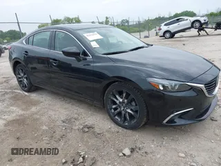 2016 Mazda 6 i Grand Touring z VIN JM1GJ1W57G1404132, wystawiony jako IAAI lot #42476279 z przebiegiem 97 792 mil mil oraz . Historia ofert i sprzedaży dostępna na DreamBid. Obrazek 1.
