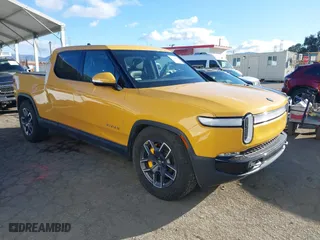 2022 Rivian R1T Adventure Package with VIN 7FCTGAAA2NN005811, listed as a IAAI auction lot 41706558 with 21,336 mi miles. Bid and sale history available at carsss.com. Image 1.