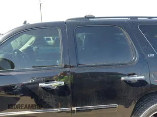 2009 Chevrolet Tahoe LTZ z VIN 1GNFC33J69R285570, wystawiony jako IAAI lot #41701424 z przebiegiem 165 811 mil mil oraz . Historia ofert i sprzedaży dostępna na DreamBid. Obrazek 14.