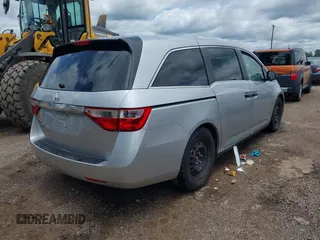 2011 Honda Odyssey LX with VIN 5FNRL5H26BB027144, listed as a IAAI auction lot 42456465 with 201,901 mi miles and . Bid and sale history available at DreamBid. Image 4.