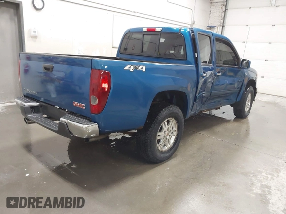 2011 GMC Canyon SLT with VIN 1GTH6NFP8B8115436, listed as a IAAI auction lot 41676023 with 148,478 mi miles. Bid and sale history available at carsss.com. Image 4.