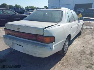1993 Toyota Camry LE with VIN 4T1SK12E6PU316163, listed as a IAAI auction lot 42046444 with 261,514 mi miles. Bid and sale history available at carsss.com. Image 4.