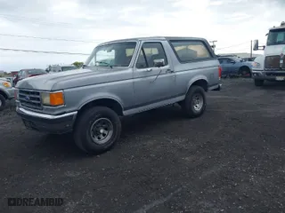 1987 Ford Bronco Custom with VIN 1FMEU15H4HLA38822, listed as a IAAI auction lot 41980537 with 81,328 mi miles. Bid and sale history available at carsss.com. Image 2.
