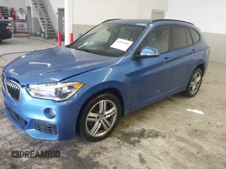 2019 BMW X1 xDrive28i with VIN WBXHT3C53K5L36690, listed as a IAAI auction lot 42012992 with 70,339 mi miles. Bid and sale history available at carsss.com. Image 17.