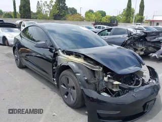 2023 Tesla Model 3 with VIN 5YJ3E1EAXPF604916, listed as a IAAI auction lot 42461640 with 28,123 mi miles and . Bid and sale history available at DreamBid. Image 1.