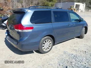 2014 Toyota Sienna LE with VIN 5TDJK3DC4ES087457, listed as a IAAI auction lot 41773128 with 103,993 mi miles and . Bid and sale history available at DreamBid. Image 4.