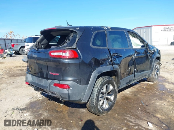 2015 Jeep Cherokee Trailhawk with VIN 1C4PJMBSXFW687737, listed as a IAAI auction lot 40963392 with 119,805 mi miles. Bid and sale history available at carsss.com. Image 6.