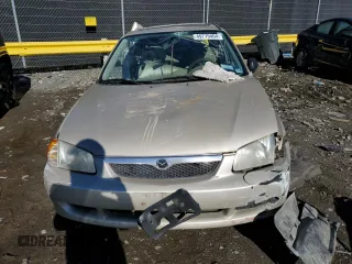 2000 Mazda Protege DX z VIN JM1BJ2220Y0197585, wystawiony jako Copart lot #65309404 z przebiegiem Nie podano mil oraz Nie do naprawy • Non repairable. Historia ofert i sprzedaży dostępna na DreamBid. Obrazek 5.